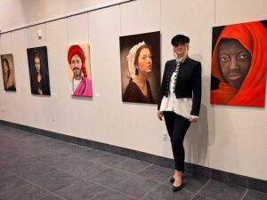 Renata Bosnjak with her “Roots of Kindness” 22 x 28 oil painting at the Summerlin Library. Photo courtesy of Renata Bosnjak